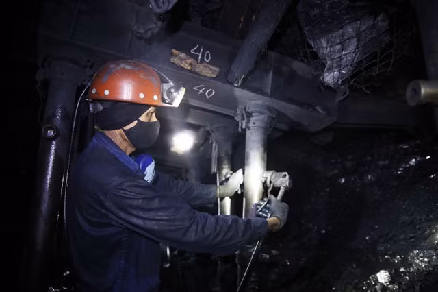 A worker at a mining site of Mông Dương Coal.