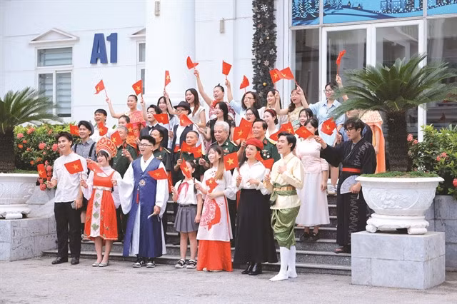 A still from music video 'Viết Tiếp Câu Chuyện Hòa Bình' by lecturers and students of Hà Nội University. The song is performed in 13 foreign languages. Photo HANU