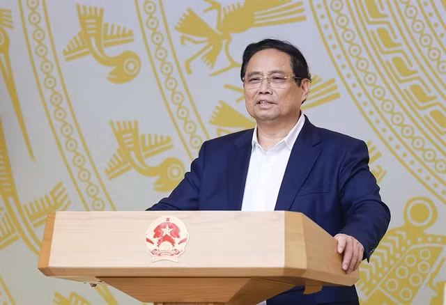 Prime Minister Phạm Minh Chính discusses issues causing slower-than-expected disbursement rate of public projects in a government meeting yesterday. — VNA/VNS Photo Dương Giang