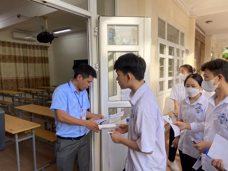 Examination officials called candidates into the examination room.