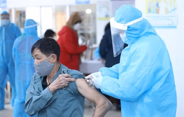 A medical worker administers a COVID vaccine to a resident in the northern mountainous province of Lạng Sơn.