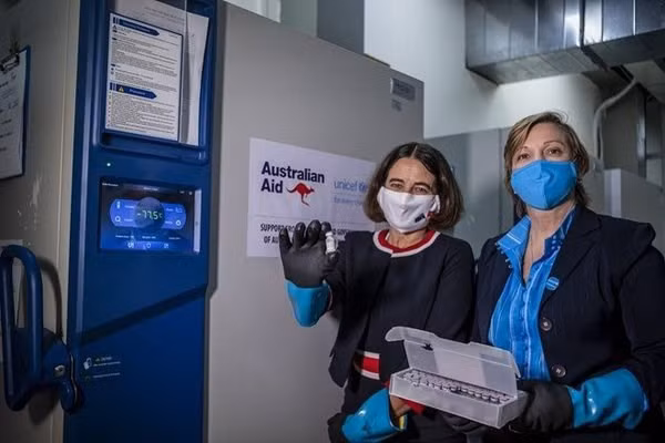 UNICEF Representative in Vietnam Rana Flowers (right) and Australian Ambassador to Vietnam Robyn Mudie (left) with the vaccines delivered to the country.