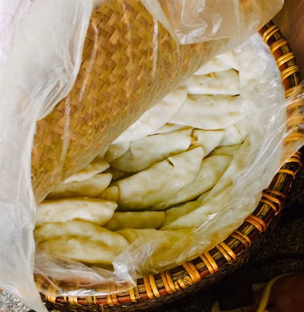 Bánh tai are often placed in a big basket lined with banana leaves and nylon cloth to ensure they stay warm.
