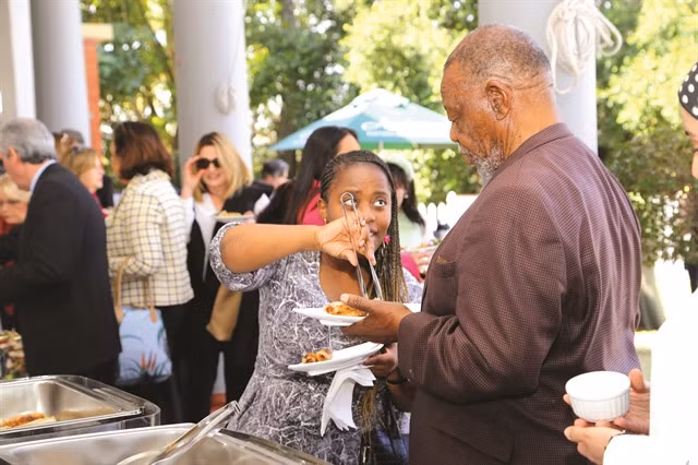 Have a bite: A South African school student helps introduce Vietnamese nem rán to visitors at the Vietnamese food stall at the Pretoria High School for Girls’ 2022 Spring Fair.