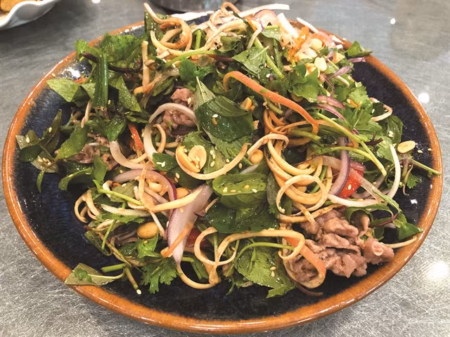 EXOTIC SALAD: Banana flower with beef, sweet and sour dressing, and coarse peanuts.