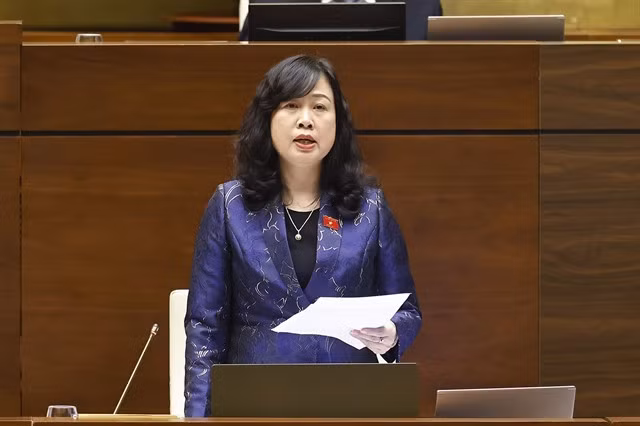 Health Minister Đào Hồng Lan responds to questions raised by NA delegates.