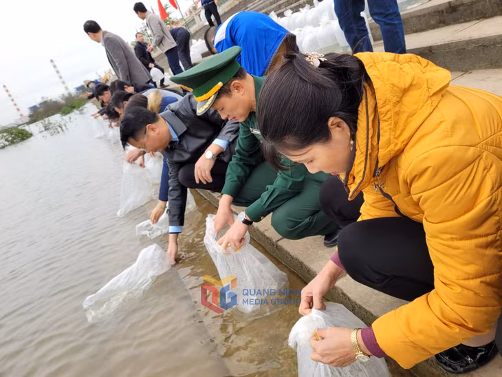 Delegates and local people released fish fingerlings into the natural environment.