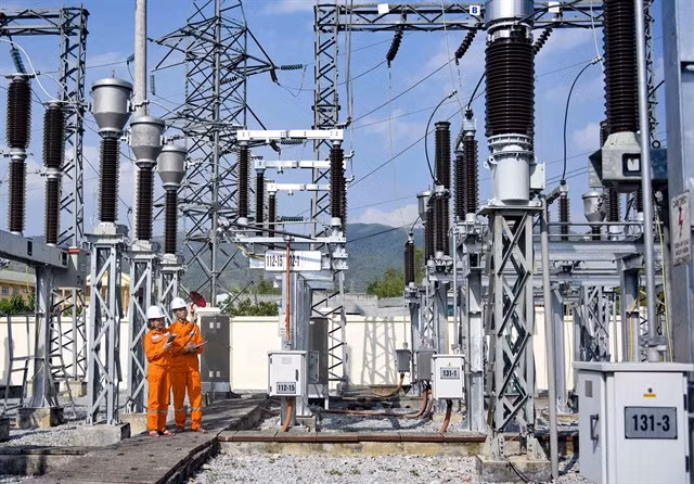Workers of Điện Biên Power Company check Điện Biên 110kV Station. — VNA/VNS Photo Xuân Tư