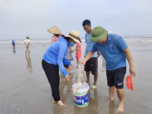 Visitors are happy with their catch.