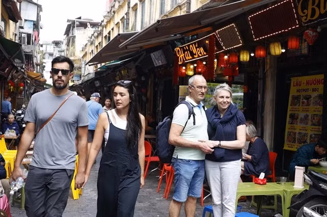Foreign tourists visit the old quarter of Hà Nội. The total number of foreign visitors coming to the capital in the first five months of the year reached 2.64 million, up by 51.9 per cent over the same period last year. — VNA/VNS Photo Minh Quyết