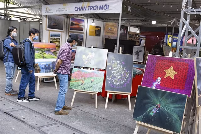 TOP PICS: Visitors view photos at the first HCM City International Photography Festival held at the Youth Cultural House in 2022. VNA/VNS Photo Đặng Kim Phương
