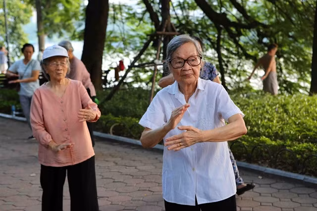 Elderly women doing physical exercise in the Hoàn Kiếm Lake area in central Hà Nội. — VNA/VNS Photo Thành Đạt