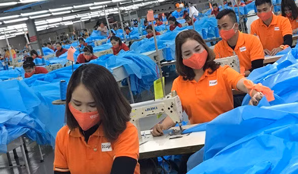 Workers at Hồ Gươm Garment Company's factory.