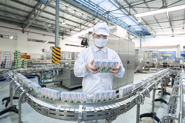 A worker checking products at a processing plant of Vinamilk. Photo courtesy of Vinamilk