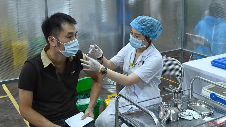A man is vaccinated against COVID-19.