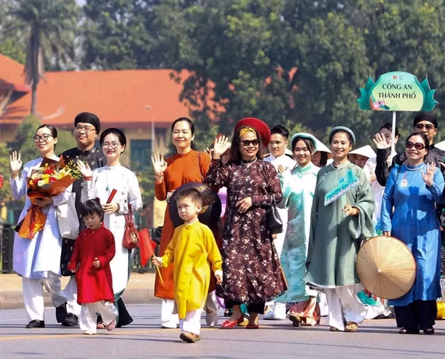 The parade features participation from numerous multi-generational families.