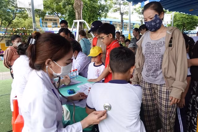 Students at an educational institution in HCM City undergo medical examinations on the premises. — VNA/VNS Photo