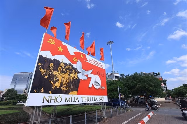 Another poster at Giải Phóng-Đại Cồ Việt Intersection which reads 'Nostalgia for Hà Nội's autumn'.