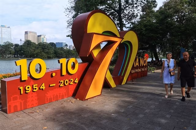 A structure celebrating the Liberation Day set up close to a lake.