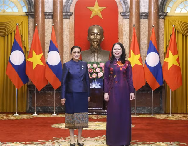 Vice President of Việt Nam Võ Thị Ánh Xuân welcomes Vice President of Laos Pany Yathotou on Tuesday in Hà Nội.