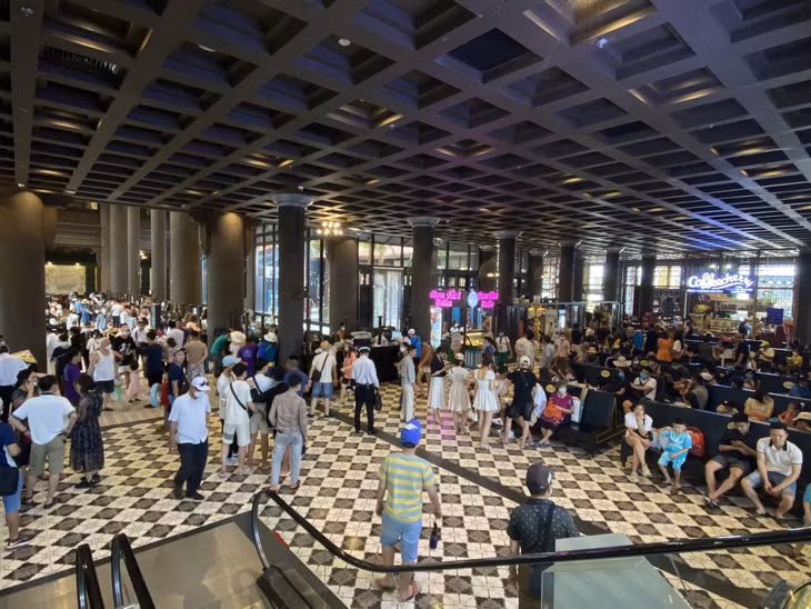 Various tourists prepare to depart their tour of Ha Long Bay from the Hon Gai International Passenger Port.