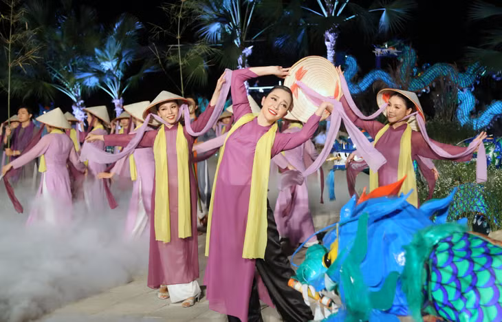 Purple Aodai and hats with poems - traditional costumes of Hue women.