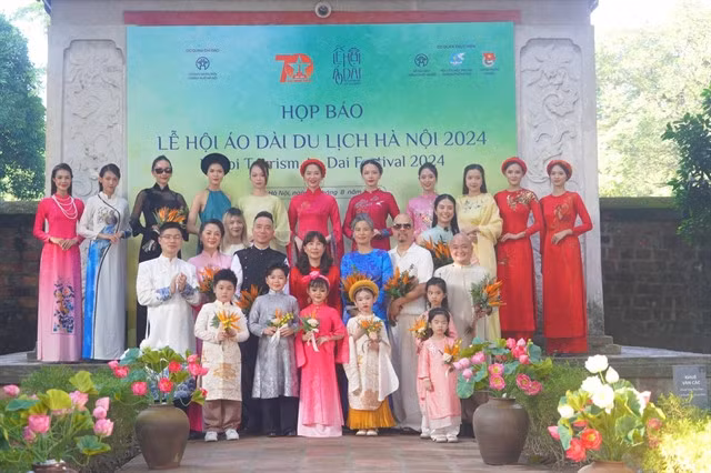 Designers and their aó dài creations at the press conference announcing the launch of Hà Nội Tourism Áo Dài Festival 2024. — Photo courtesy of the Hanoi Department of Tourism
