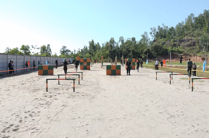 Athletes compete intensely in the obstacle course event.