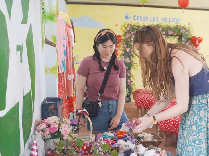 Visitors seem excited about recycled products.