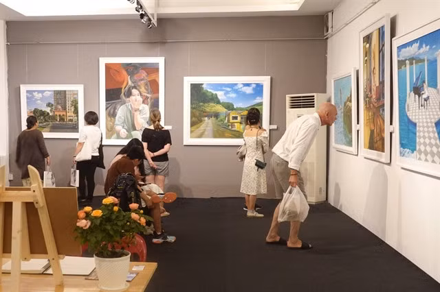 ENJOYING ART: The exhibition attracts both local and foreign viewers. — Photo courtesy of the artist