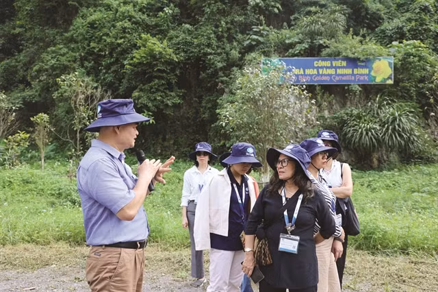 PARK LIFE:Vũ Văn Tâm introduces the park to visitors. VNS Photo Hồng Vân