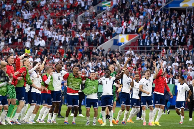 England players dancing to celebrate their progression into the semifinals. XINHUA/VNA Photo