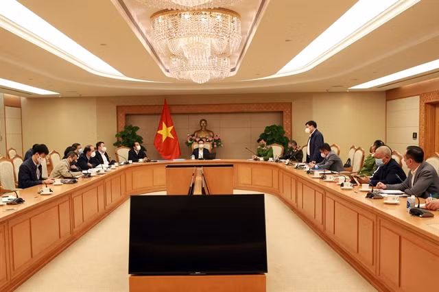 Deputy Prime Minister Vũ Đức Đam in a meeting with the ministries on COVID-19 pandemic control and prevention for Vietnamese nationals, and foreigners entering the country from abroad. — Photo baochinhphu.vn