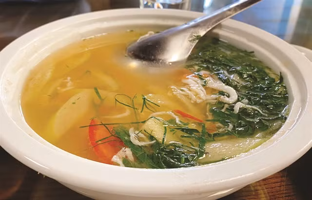 Sour Ngần fish soup has the sour taste of green tamarind and the savoury taste of fish. VNA/VNS Photo Bảo Ngọc