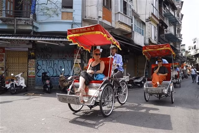 International tourists visit Hà Nội's Old Quarter.