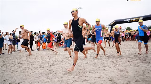 Athletes take part in the swim stage of the tournament.