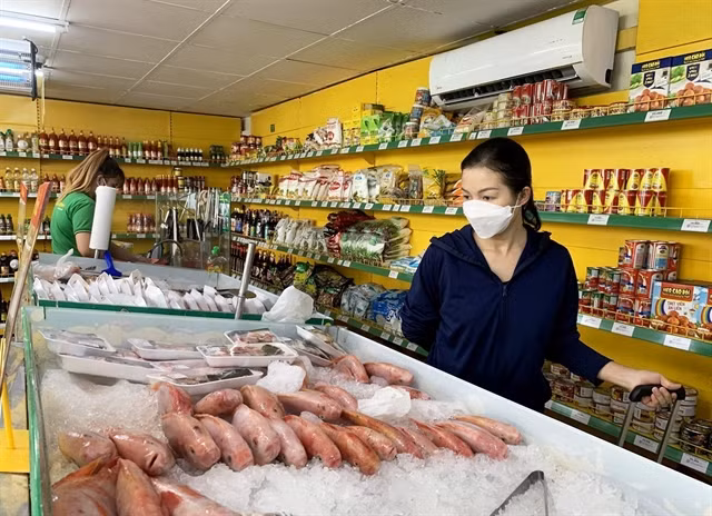 Customers shop at a supermarket in HCM City. VNA/VNS Photo