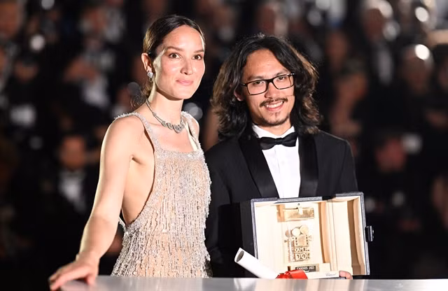 Phạm Thiên Ân wins the Caméra d’Or Award for his film 'Inside the Yellow Cocoon Shell' at the Grand Lumière Theatre in Cannes on Saturday. — Photo courtesy of Festival de Cannes