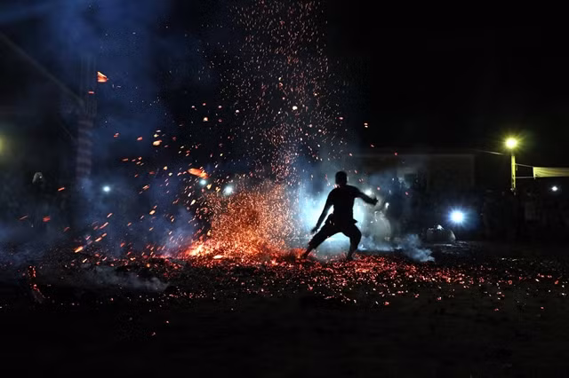 The practice of fire jumping aims to dispel fear and weakness. — VNA/VNS Photo Quang Cường