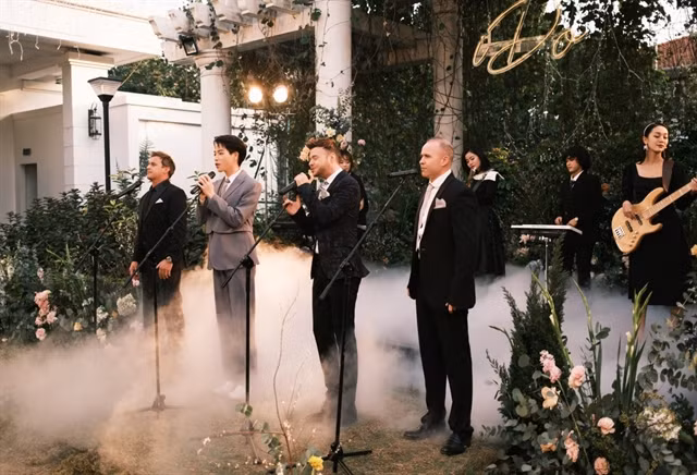The music video, Em Đồng Ý (I Do), by English pop group 911 and Vietnamese singer Đức Phúc (in grey suit), has attracted more than 958,000 views only one day after its release on YouTube on February 9. Photo courtesy of the producer.