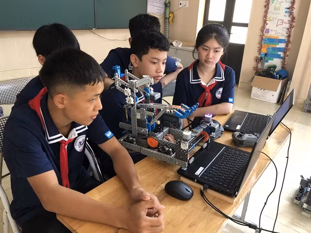 A robotics team review their robot programming at Đông Các School in northern Thái Bình Province. — Photo courtesy of Đông Các School.